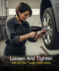 No Nonsense 1/2 Inch Air Impact Wrench Featuring Killer Torque Specs And Rock Solid Magnesium Alloy Composite Housing For Legit Garage Grinds And Daily Heavy Duty Drives Delivering Up To 1600 Ft Lbs Of Raw Pull For Real Pro Shop Work in use by a worker loosening a lug nut on a car wheel.