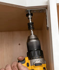 No Sweat Quick Grab Magnetic Depth Stop Bit Holder For Impact Driver And Power Drill with screw being fastened into cabinet.