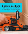 Person using Heavy Duty Belt Sander With Dust Bag 7 Amp Motor 3 Inch By 21 Inch Angled Sanding Belt, showing 3 handle positions.