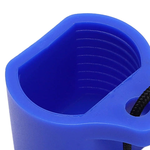 Close-up of blue threaded rubber scuba tank valve cap shield for dust and sand protection, showing inner grooves and loop attachment.