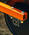 Close-up of a Six Foot Drum Spike Aerator For 3 Point Hitch On Cat 1 And Cat 2 Tractors, showing metal frame and bearing detail