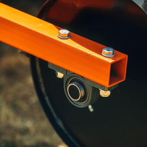 Close-up of a Six Foot Drum Spike Aerator For 3 Point Hitch On Cat 1 And Cat 2 Tractors, showing metal frame and bearing detail
