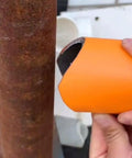 Close-up of Heavy Duty Pipe Notcher Tool Kit With Ten Piece Saddle Template Set for smooth layout on rusted metal pipe.