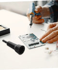 Beast Mode Automatic Wire Stripper For Electric Cable Gauge Quick Connector Socket Rotator Drill Attachment Tool on workspace with soldering tool.