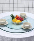Double Layer Quiet Bearing Lazy Susan Turntable With Tempered Glass Edge for dining with fruit bowl and dishes on table