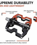 Black and red Ultra Light Nine Sixteen Inch Aluminum Mountain Bike Pedals with CNC bearing and anti-slip spikes.
