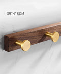 Heavy Duty Solid Wood Double Coat Hook With Sleek Brushed Gold Finish Wall Mounted Robe Rack on bathroom wall.