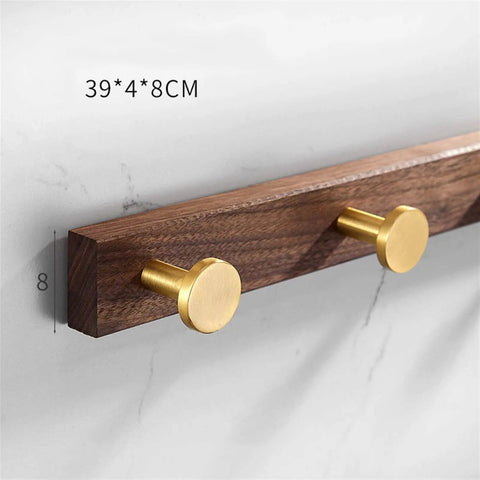 Heavy Duty Solid Wood Double Coat Hook With Sleek Brushed Gold Finish Wall Mounted Robe Rack on bathroom wall.