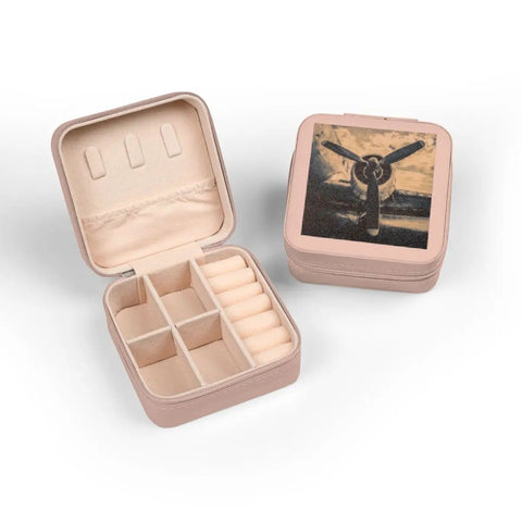 Open pink Propeller Inspired Aviation Jewelry Travel Case with plush lining, compartments, and ring rolls, 4x4x2 inches.