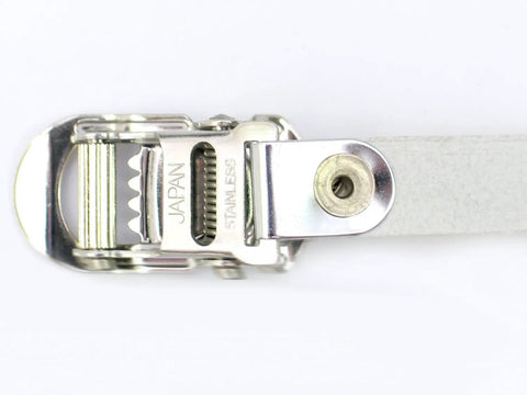 Close-up of a metal buckle on black leather toe strap, part of Premium Black Leather Toe Straps 420mm Long Pair For Pedals Built For Real World Rides Durable Slip Resistant Grip For Daily Commutes And Weekend Road Trips.