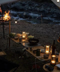 Portable Metal Table Lamp Cordless Rechargeable LED Light with 3 Color Infinitely Dimming Battery Powered Lamp in camping setting.