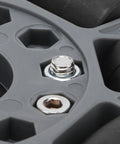Omni wheel hub, 100mm nylon rubber, close-up showing metal axle bolt in gray mounting plate.
