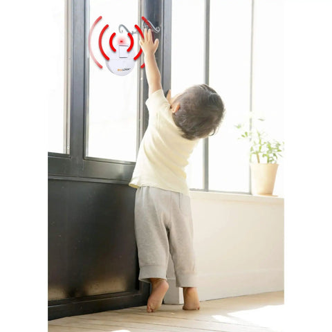 Child reaching for Ultra Thin Window Alarm With 120dB Loud Alarm And Vibration Sensor on glass door, home security device.