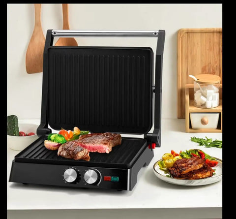 Heavy Duty 1000W Electric Panini Press Grill With Non Stick Plates Opens 180 Degrees For Any Size Food 3 in 1 Sandwich Maker Stainless Steel Surface Removable Drip Tray Fast Heating Indoor Grill with steak and vegetables.