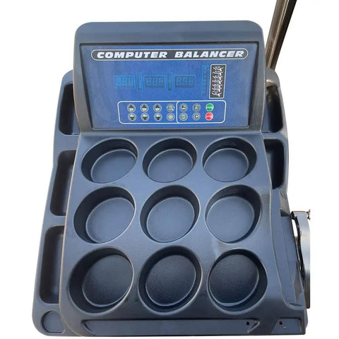 Heavy Duty Wheel Balancer Precise One Gram Accuracy Self Calibrating Garage Ready Tire Machine control panel and rim trays.