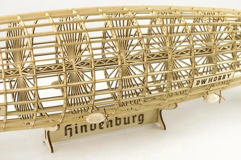 1:408 Hindenburg Zeppelin 3D Wooden Model Kit With Display Case, showing laser cut balsa wood structure on stand