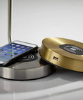 Emerson Desk Lamp With Wireless Charging Pad And USB Port 7W LED Reading Light showing gold and silver charging bases with a phone.