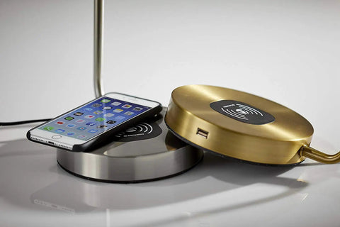 Emerson Desk Lamp With Wireless Charging Pad And USB Port 7W LED Reading Light showing gold and silver charging bases with a phone.