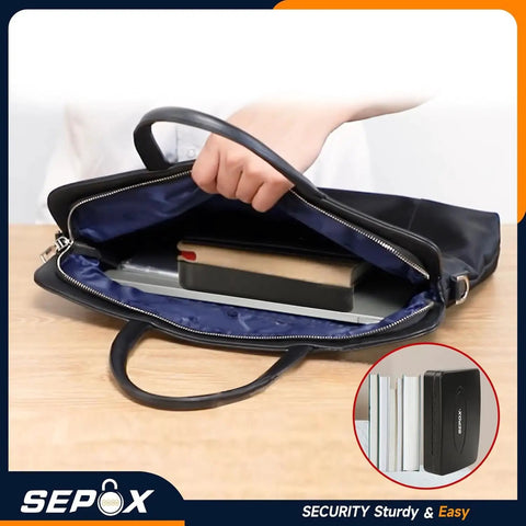 Water And Fire Resistant Portable Security Case With Solid Steel Build inside a handbag, showing compact design for travel.