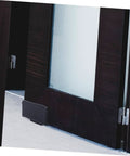 Barn Door Track Stop Floor Guide Ground Mount Adjustable Black Carbon Steel Hardware Kit For Sliding Doors Works On Pre Grooved Or Non Grooved Doors Easy To Install DIY Barn Door Accessory shown installed on a barn door.