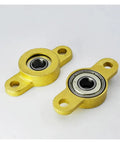 Thinking Process:. 5mm yellow metal pillow block bearing unit with two mounting holes for industrial shaft support
