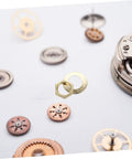 Close-up of clock gears with golden metal components from Clock Movement Nut Set With Washers 14 Pcs Replacement Parts Kit.