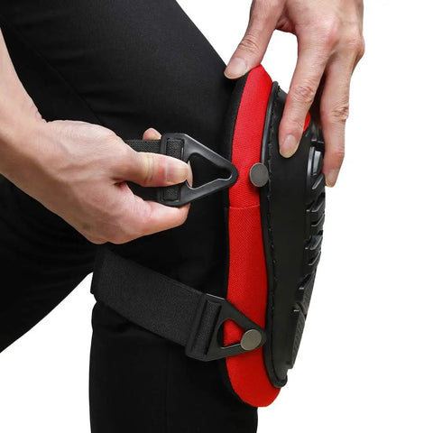 Person adjusting Knee Pads For Work With Soft Gel Core And EVA Foam Padding, ergonomic design in red and black with adjustable straps