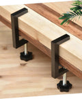 Rattan Furniture Clamp 2 Pack For Patio And Sectional Sofas, shown securing wooden slat in place, outdoor setup.