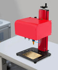 Boss Level Pneumatic Dot Peen Marking Machine Running Tight As A Drum With Deep Carving Power For Everyday Metalwork and Garage Builds Across A Heavy Duty Two Hundred By One Thirty Millimeter Work Table on a white tabletop.
