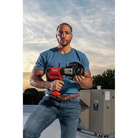 Man holding RP 350 ProPress Pressing Tool And Battery Kit With 18 Volt Battery And Charger For Pro Plumbers And HVAC Pros