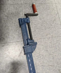 Heavy Duty I Bar Clamp Four Foot Length With Throat One And Thirteen Sixteenths Inches And Clamp Face One And Seven Eighths Inches Six Thousand Lbs Clamping Force Rapid Acting No Slip Clutches For Everyday Woodworking And Fabrication Workhorse steel bar clamp on floor