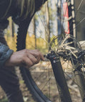 Using the Lockdown Driver 7 In 1 EDC Multitool With A 2.5 Inch Plain Edge Blade on a bicycle wheel outdoors
