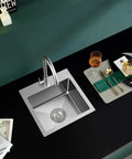 Top view of 20 Inch Drop In Kitchen Sink in Stainless Steel with Brushed Nickel Finish, single bowl in a compact black countertop