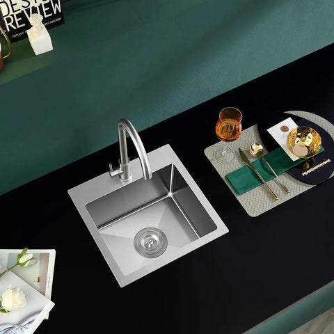 Top view of 20 Inch Drop In Kitchen Sink in Stainless Steel with Brushed Nickel Finish, single bowl in a compact black countertop