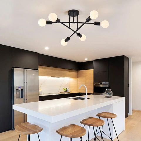 Six Lights Sputnik Style Semi Flush Mount Ceiling Chandelier in black in modern kitchen with wooden bar stools and marble countertop.