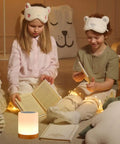 Children reading next to Night Light Touch Sensor Lamp For Kids Bedroom And Nightstand Rechargeable Dimmable Warm White