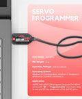 USB Servo Programmer Adapter Easy Peasy Setup Configurable Motor Controller With Windows Compatibility No Sweat Wiring For Rc Drone Hobby Rig next to laptop for setup.