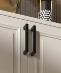 Five Pack Black Stainless Steel Cabinet Pulls For 18 Inch Drawer Cabinets on white cabinet doors in modern kitchen.