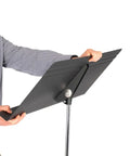 Person adjusting Fourscore Music Stand With Extra Wide 32 Inch Desk For Large Scores And Ensembles Heavy Duty Aluminum
