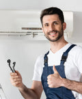 Technician holding an HVAC Service Wrench Set for Refrigeration and Air Conditioning, Curved Ratchet Wrench Tool in front of AC unit