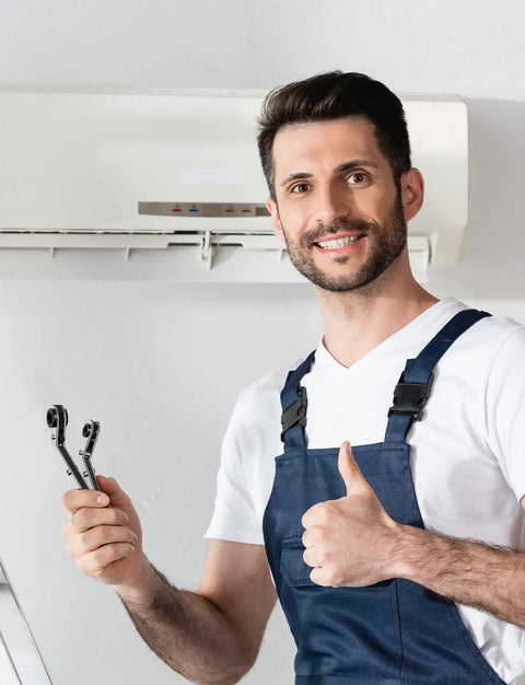 Technician holding an HVAC Service Wrench Set for Refrigeration and Air Conditioning, Curved Ratchet Wrench Tool in front of AC unit