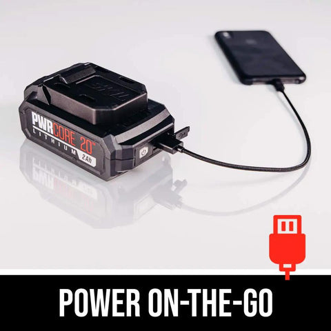 PWR CORE 20 2.0Ah battery from Beast Mode Cordless Jigsaw Kit With USB charging a smartphone, showcasing portability.
