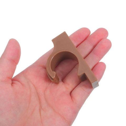 Hand holding brown heavy duty folding furniture retainer clip buckle for garden stool and picnic table secure locking clip
