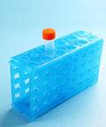 Linkable 4-Way Plastic Test Tube Rack Set In Assorted Blue Green Yellow Colors, Pack Of 3, Heavy-Duty Polypropylene on blue background