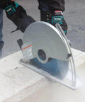 14 Inch Electric Angle Cutter Powered By A Rugged Fifteen Amp Motor And Smart Slip Clutch Design To Save Your Gears cutting through concrete block.