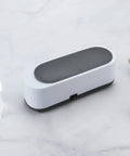 Ultrasonic Cleaner For Glasses Jewelry And Dentures Portable Small Desktop Machine with anti-slip base on marble surface