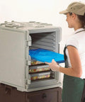 Person inserting Camchiller Cold Pack 21 By 13 Inch Full Size For Front Loading Food Pan Carriers And Carts Keeps Foods Safely Below 41 Degrees
