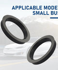 Set Of Four Black Wheel Hub Center Rings With 2.87 Inch Od And 2.36 Inch Id Plastic Adapters displayed against a scenic background.