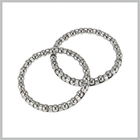 Two bicycle ball bearing retainers from 4 Pack Bicycle Ball Bearing Retainers With 22 Balls 40mm Outer Diameter And 33.5mm Inner Diameter Beefy Steel Cages For Crank And Wheel Bearings Replacement For Bikes And Cars, showing steel balls.
