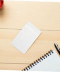 Translucent Glassine Envelopes 200 Pack 9x12 Plus 3cm Frosted Paper Bag on a wooden table with notebook and pen